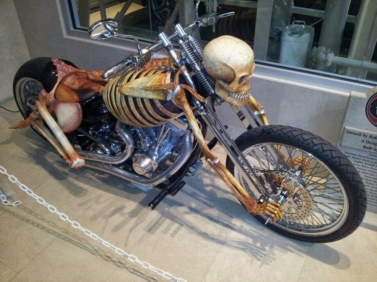 Motorcycle with artistic, hand-painted bodywork and sculptural elements, featured among the strangest motorcycles of 202