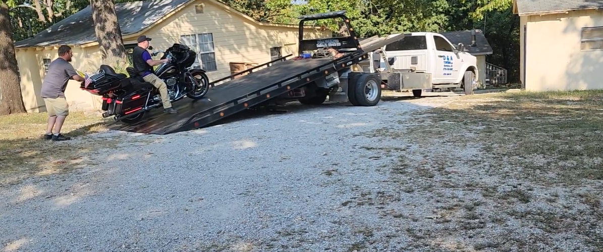 tow truck picking up broke down harley davidson near branson mo